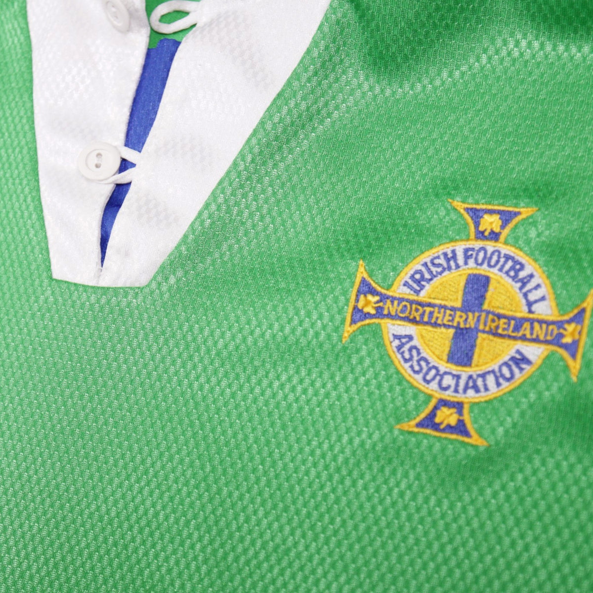 Close-up of the collar, button placket and Irish Football Association crest on the Northern Ireland home shirt