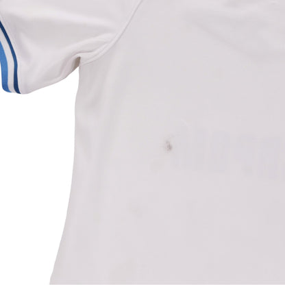 Close-up of lower back of the shirt showing a small faint mark