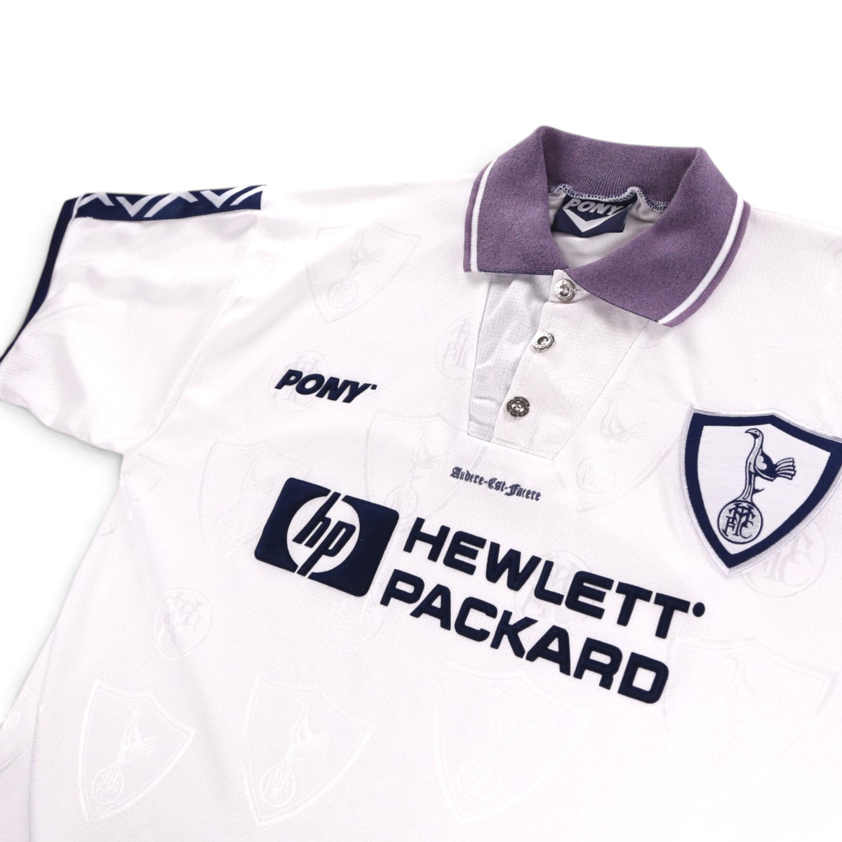 Close-up of Tottenham Hotspur shirt collar, buttons and crest