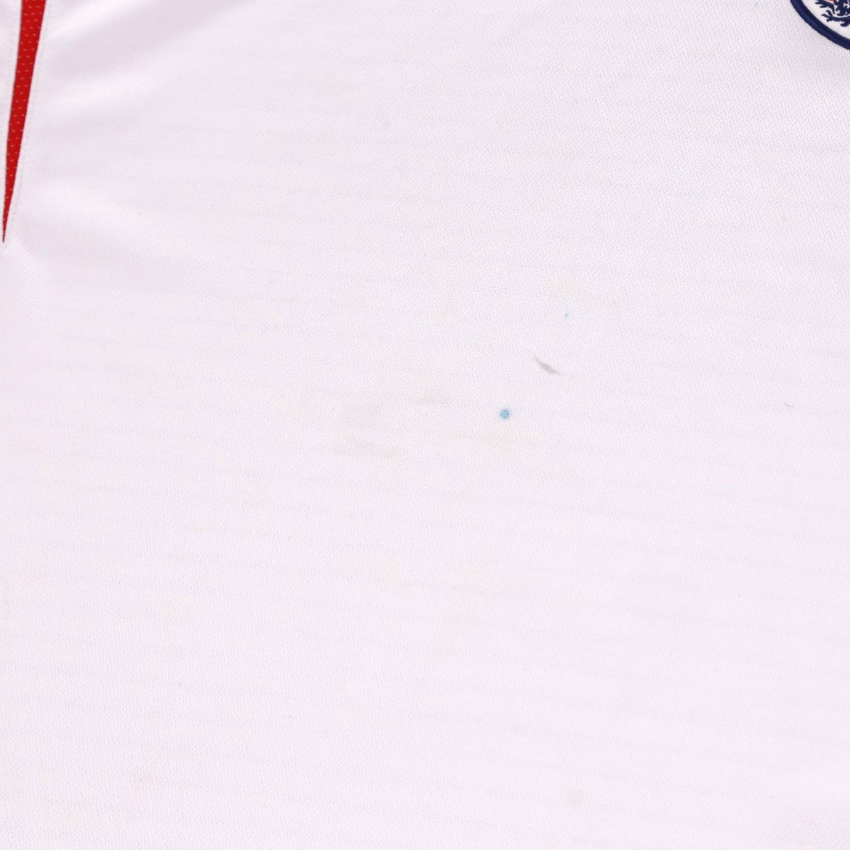 Close-up of white fabric on England home shirt showing faint marks