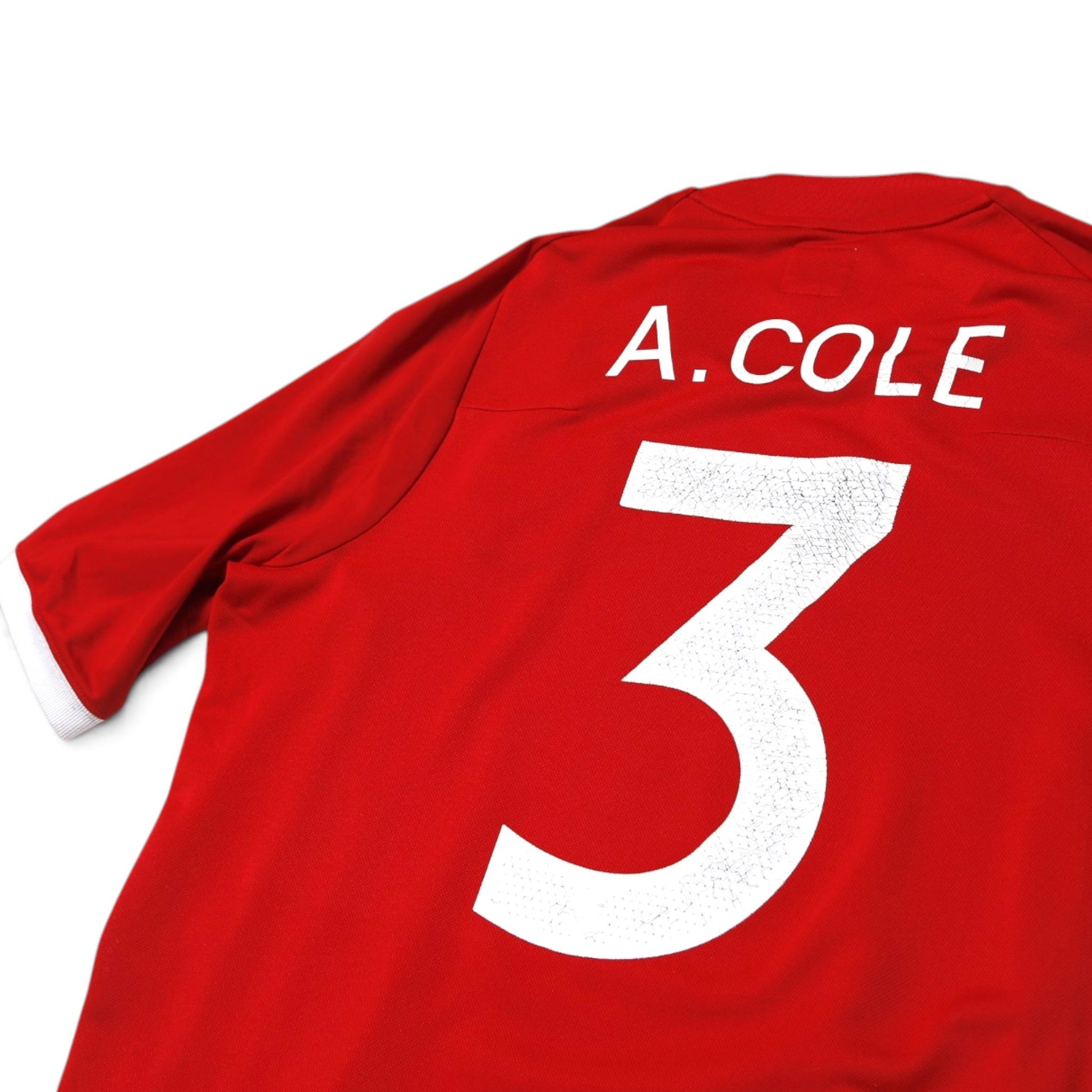Close-up of A. Cole number 3 print showing surface cracking on 2010/11 England away shirt