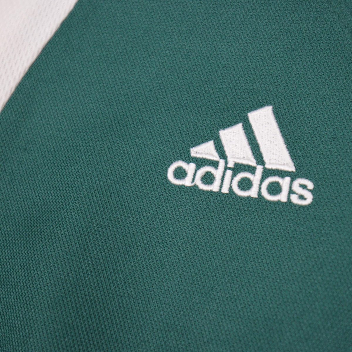 Close-up of the adidas logo embroidered on the sleeve