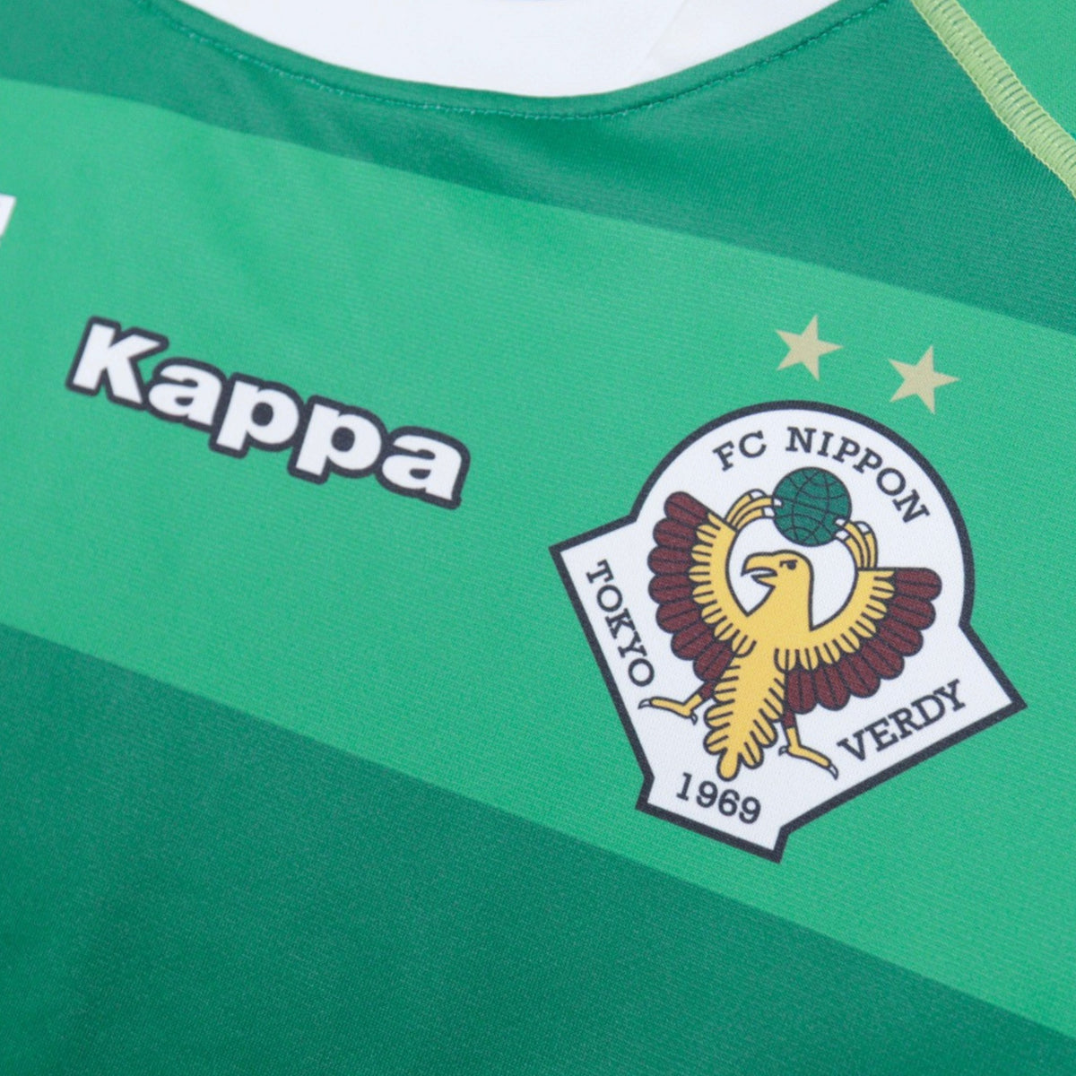 Close-up of the Kappa logo and Tokyo Verdy crest with two gold stars on the chest