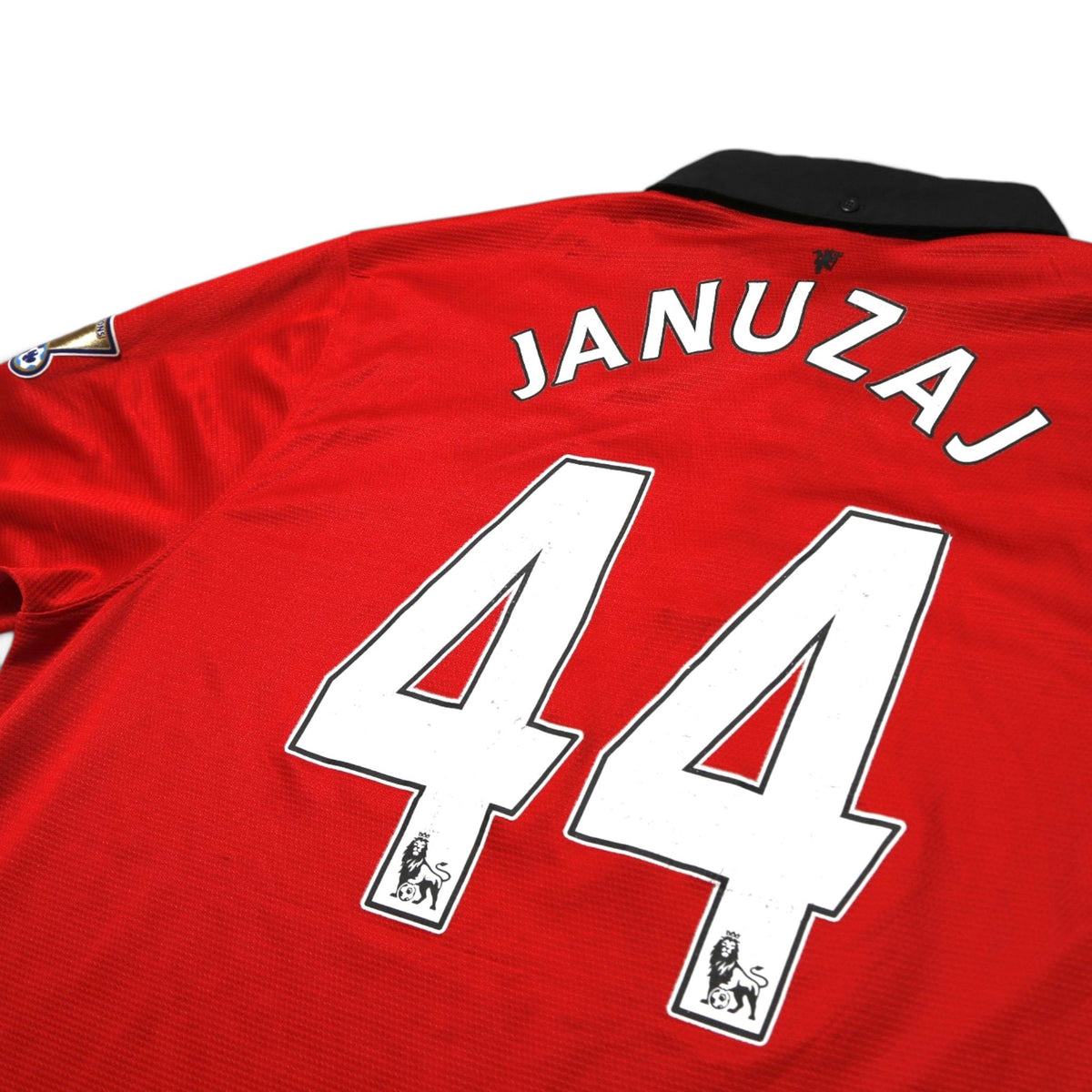 Close-up of Januzaj 44 print and Premier League badge on shirt