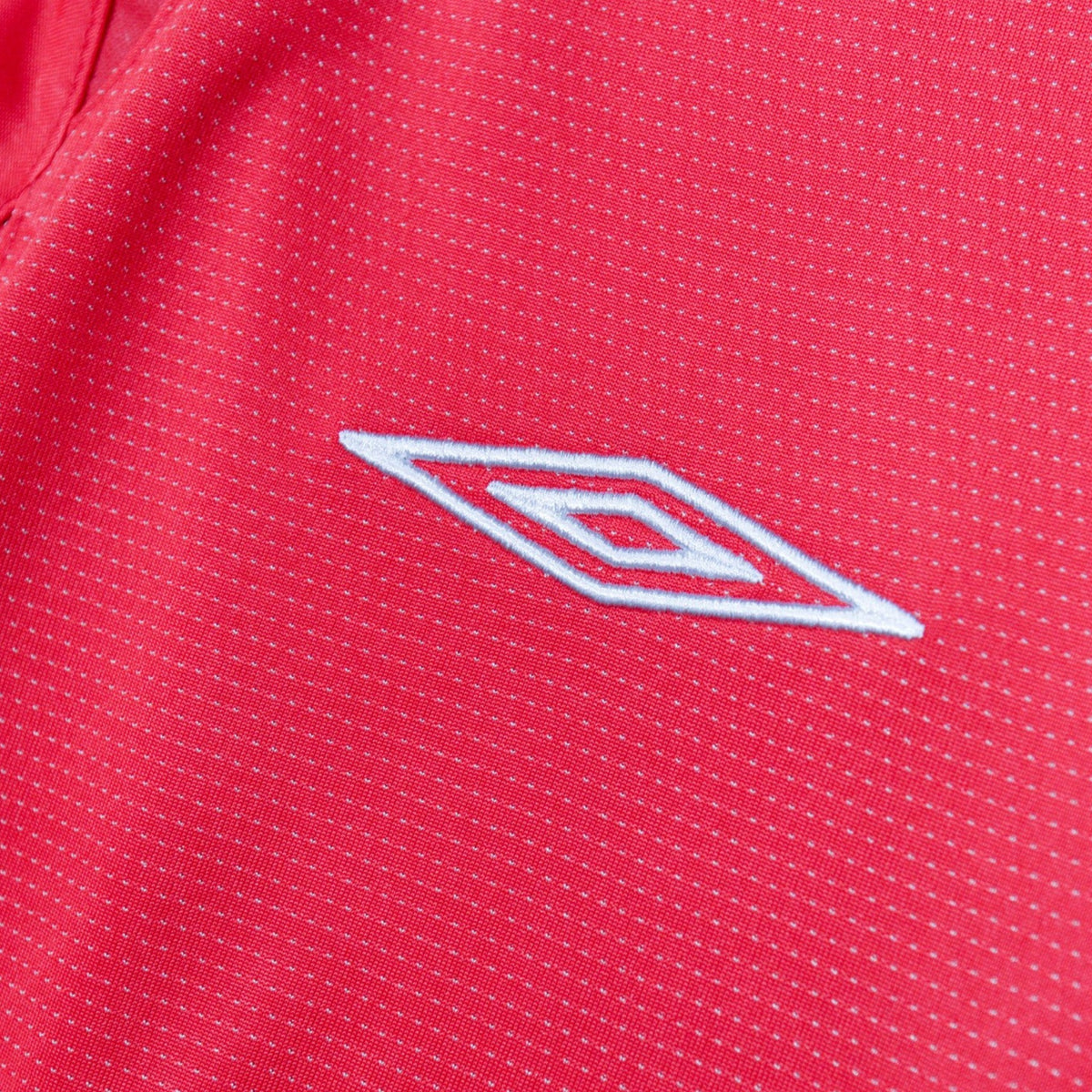 Close-up of embroidered Umbro logo on the sleeve