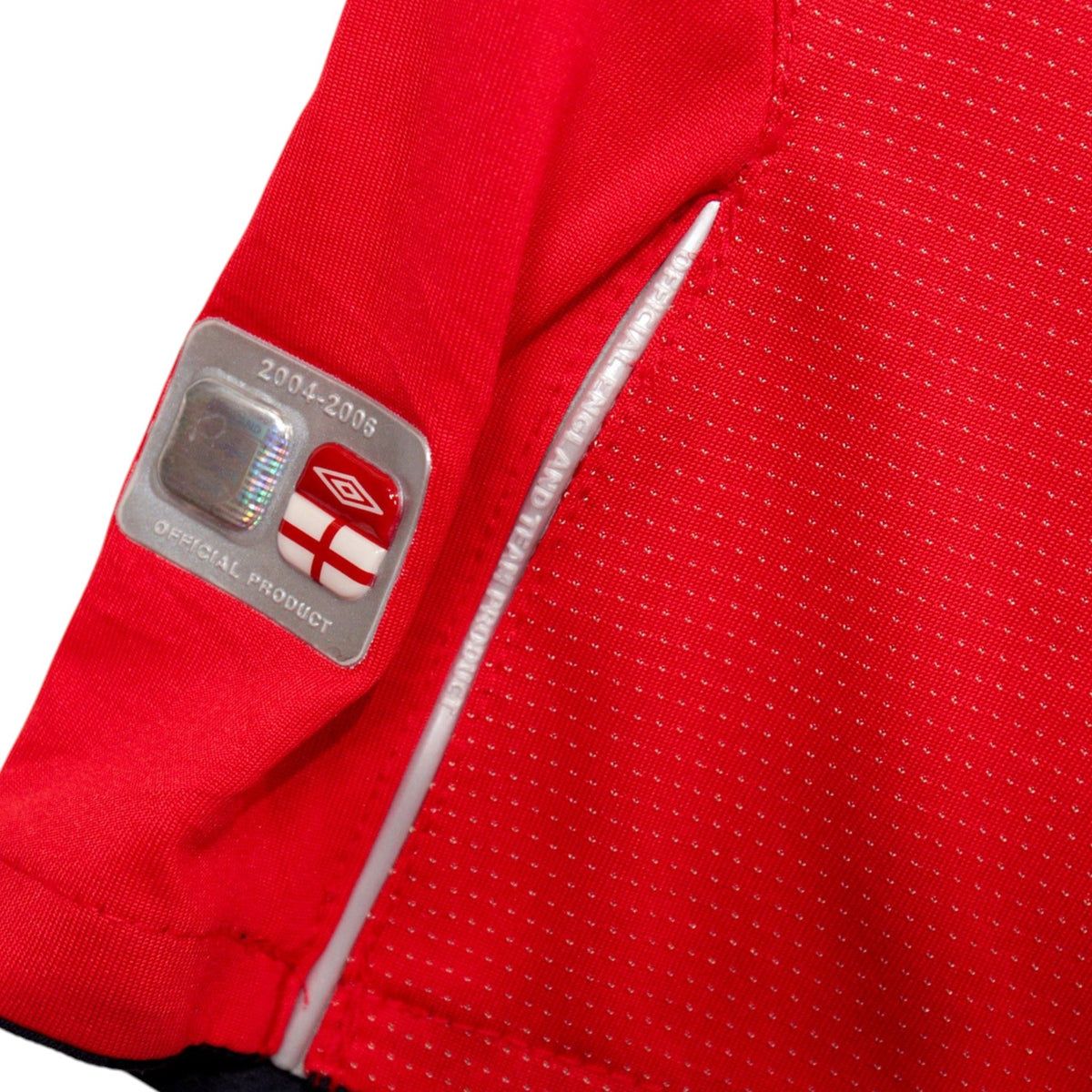 Close-up of hem hologram tag reading 2004-2006 Official Product