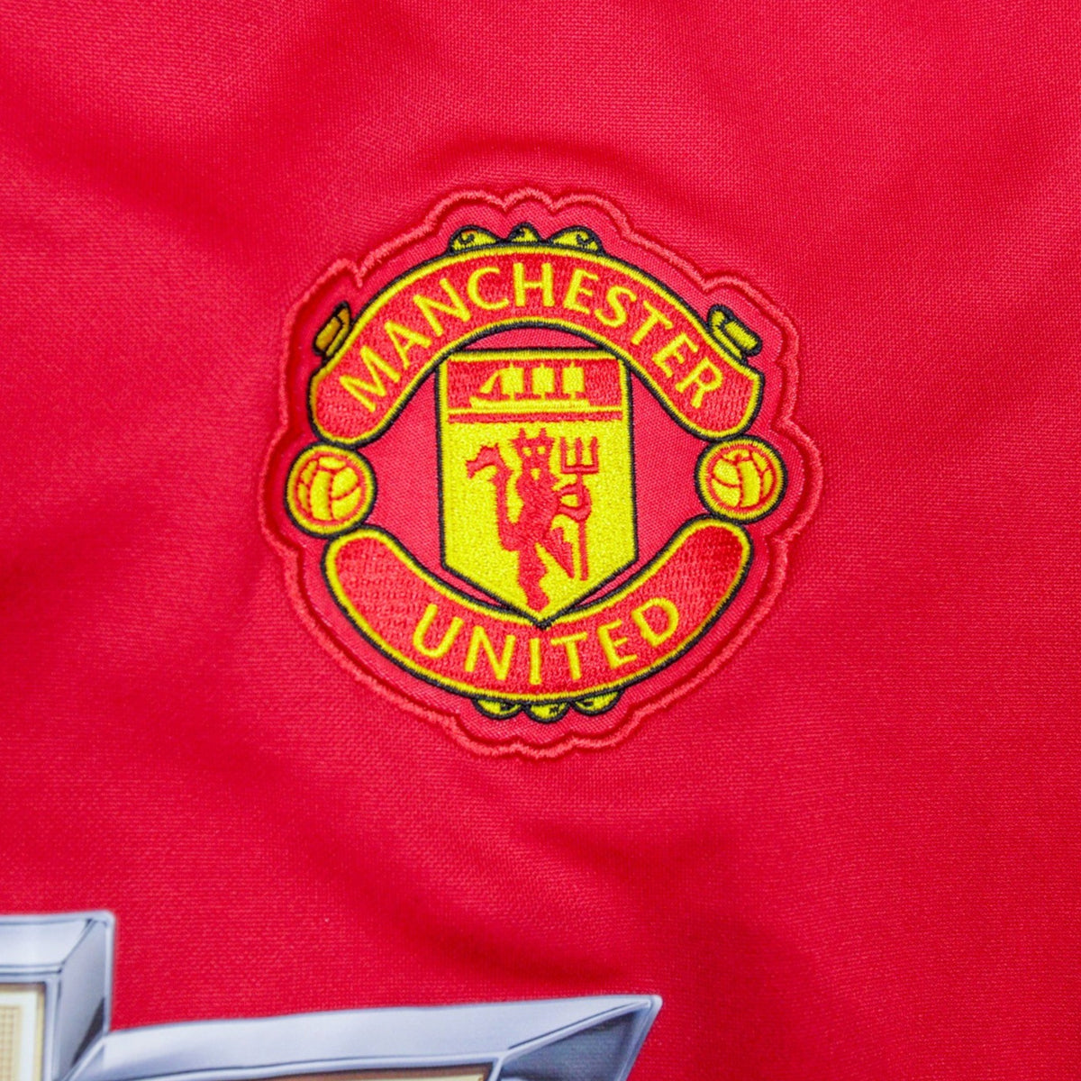 Close-up of the Manchester United crest embroidery