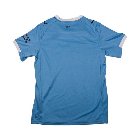 Back of the sky blue Manchester City home shirt showing the white crew neck