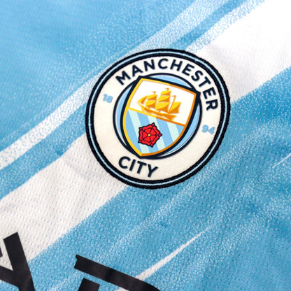 Close-up of the Manchester City crest on the chest of the shirt