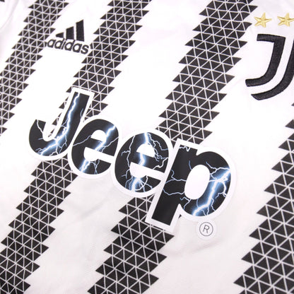 Close-up of adidas logo, Jeep sponsor and Juventus crest on the shirt front
