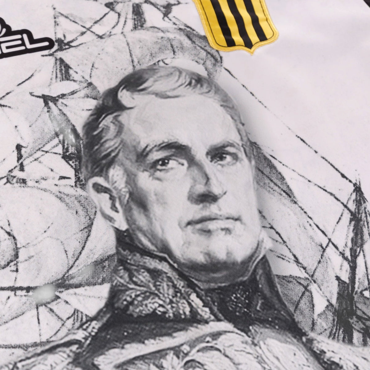 Close-up detail of the printed portrait and crest on the chest