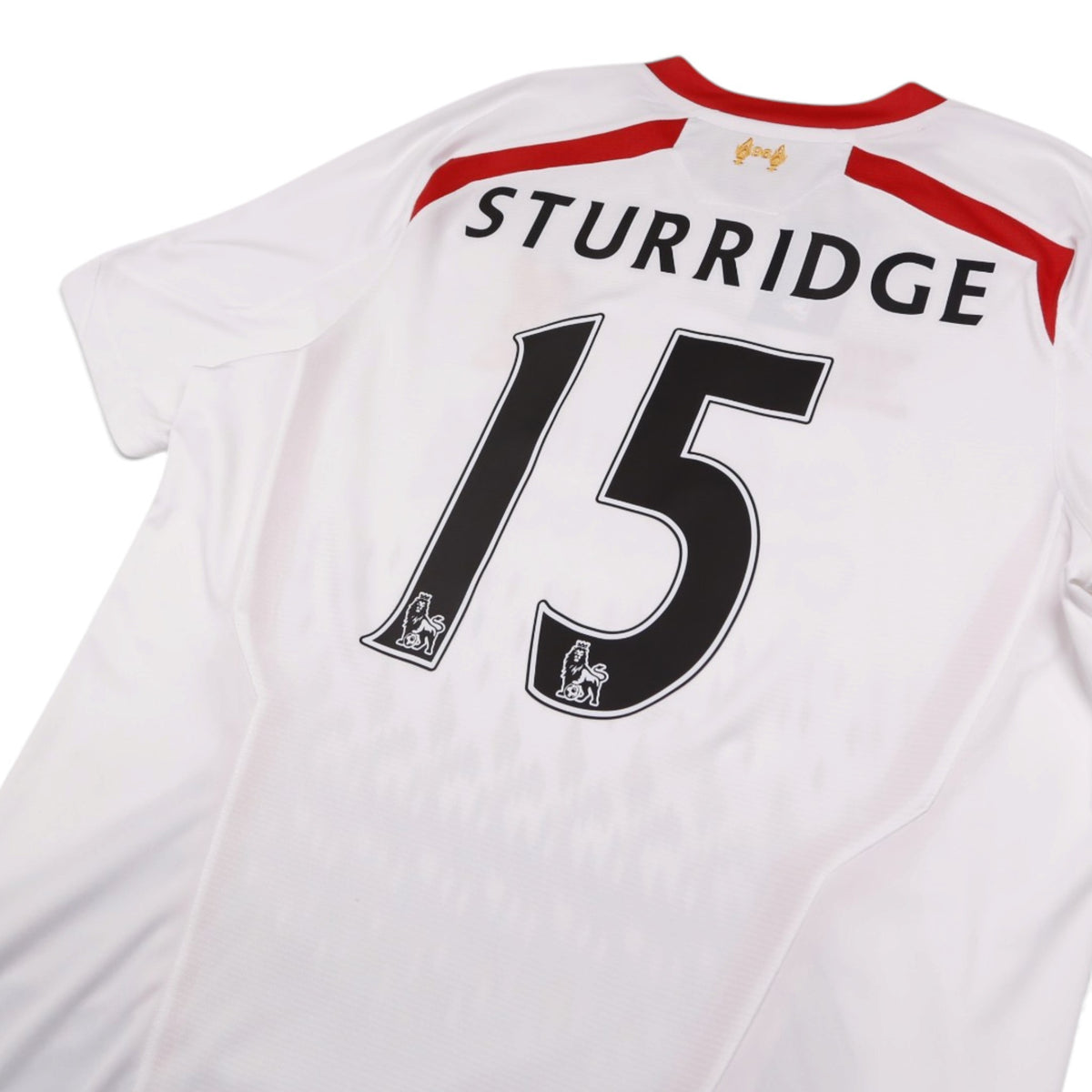 Close-up of Sturridge 15 print on Liverpool away shirt back with Premier League lion badges