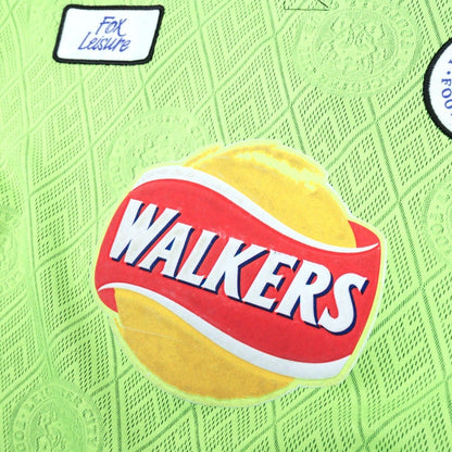 Close-up of the Fox Leisure tag, crest and Walkers sponsor on the chest