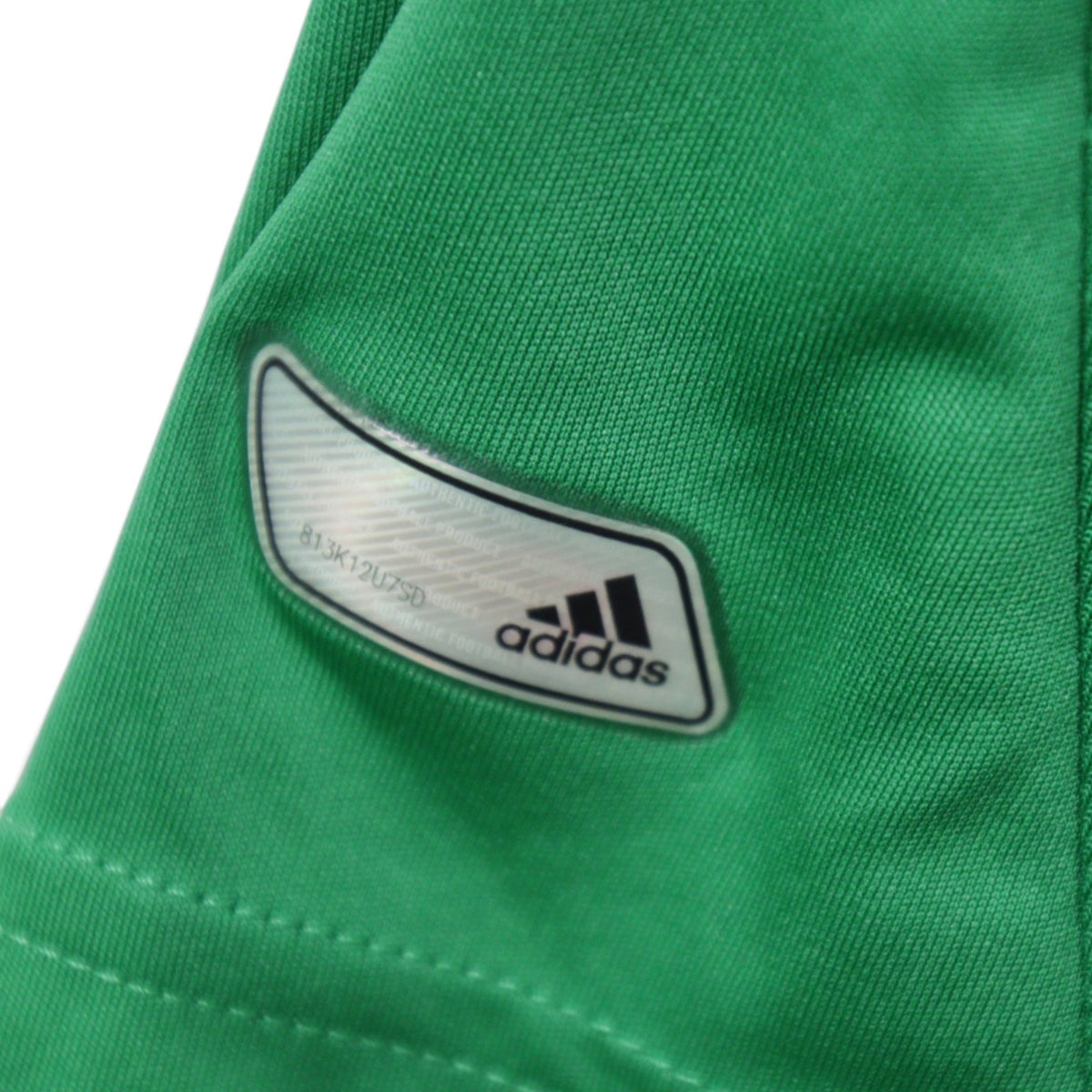 Close-up of the adidas neck label and Climacool branding on the 2012/13 Germany away shirt