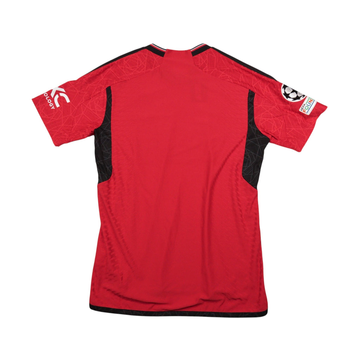 2023/24 Manchester United home shirt, back view showing plain red back and sleeve patches