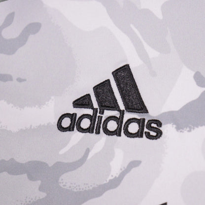 Close-up of the embroidered adidas logo on the New England Revolution away shirt