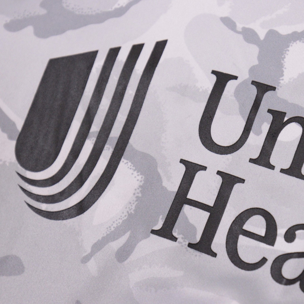 Close-up of the United Healthcare sponsor print on the New England Revolution away shirt