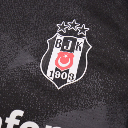 Close-up of the Besiktas three-star crest on the shirt