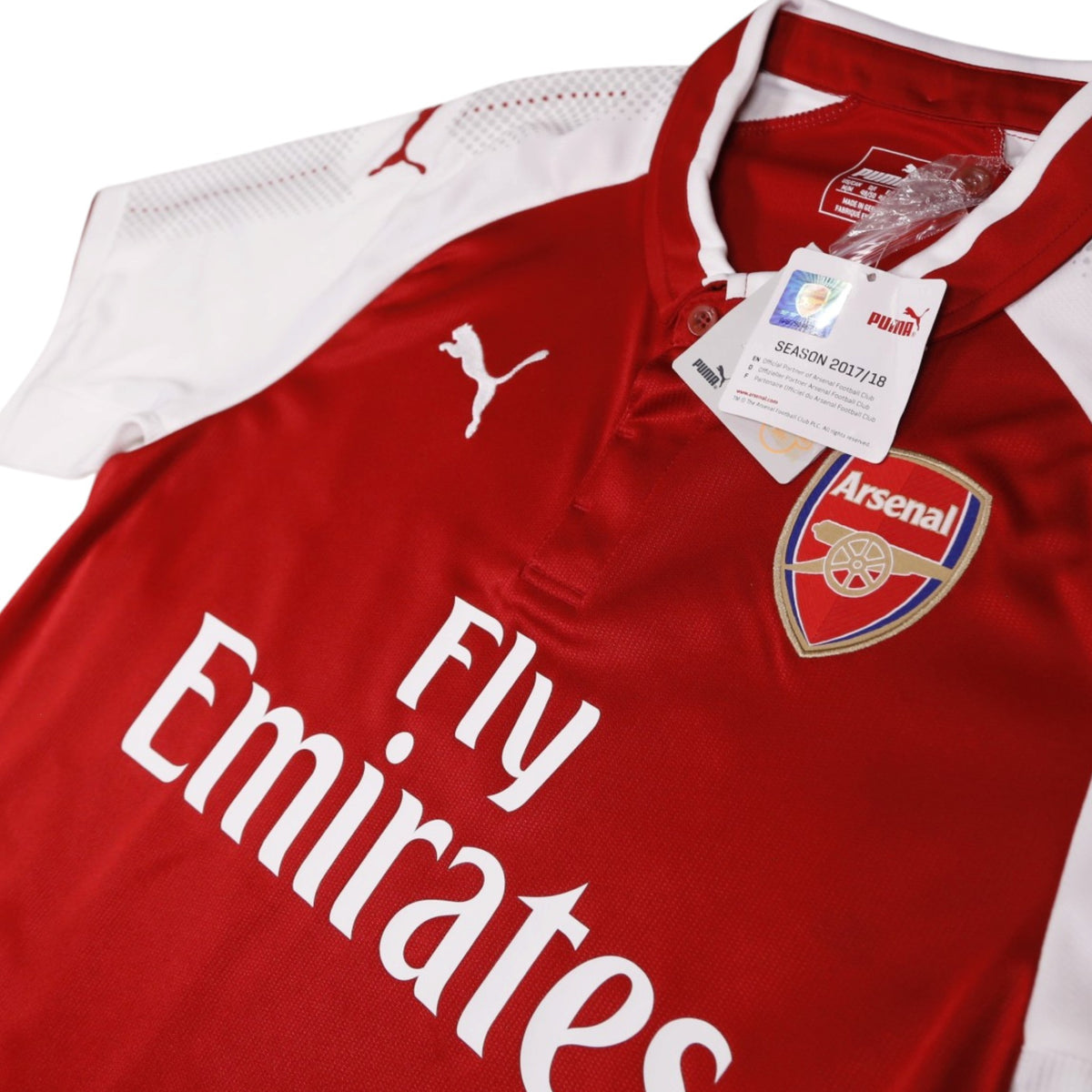 Close-up of Arsenal crest, Puma logo and 2017/18 season hangtag on the shirt