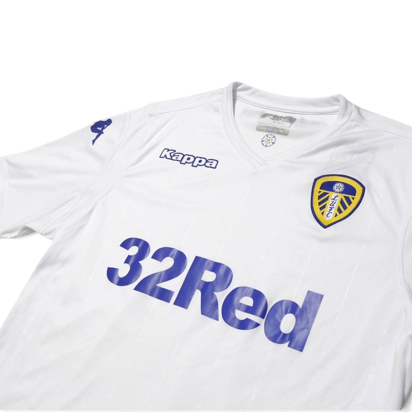 Close-up of Leeds United shirt collar, Kappa logo and 32Red sponsor print