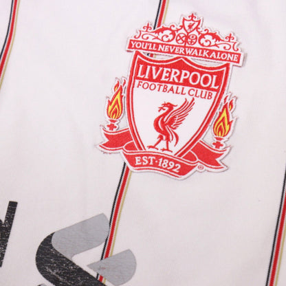 Close-up of the embroidered Liverpool FC crest with You'll Never Walk Alone banner