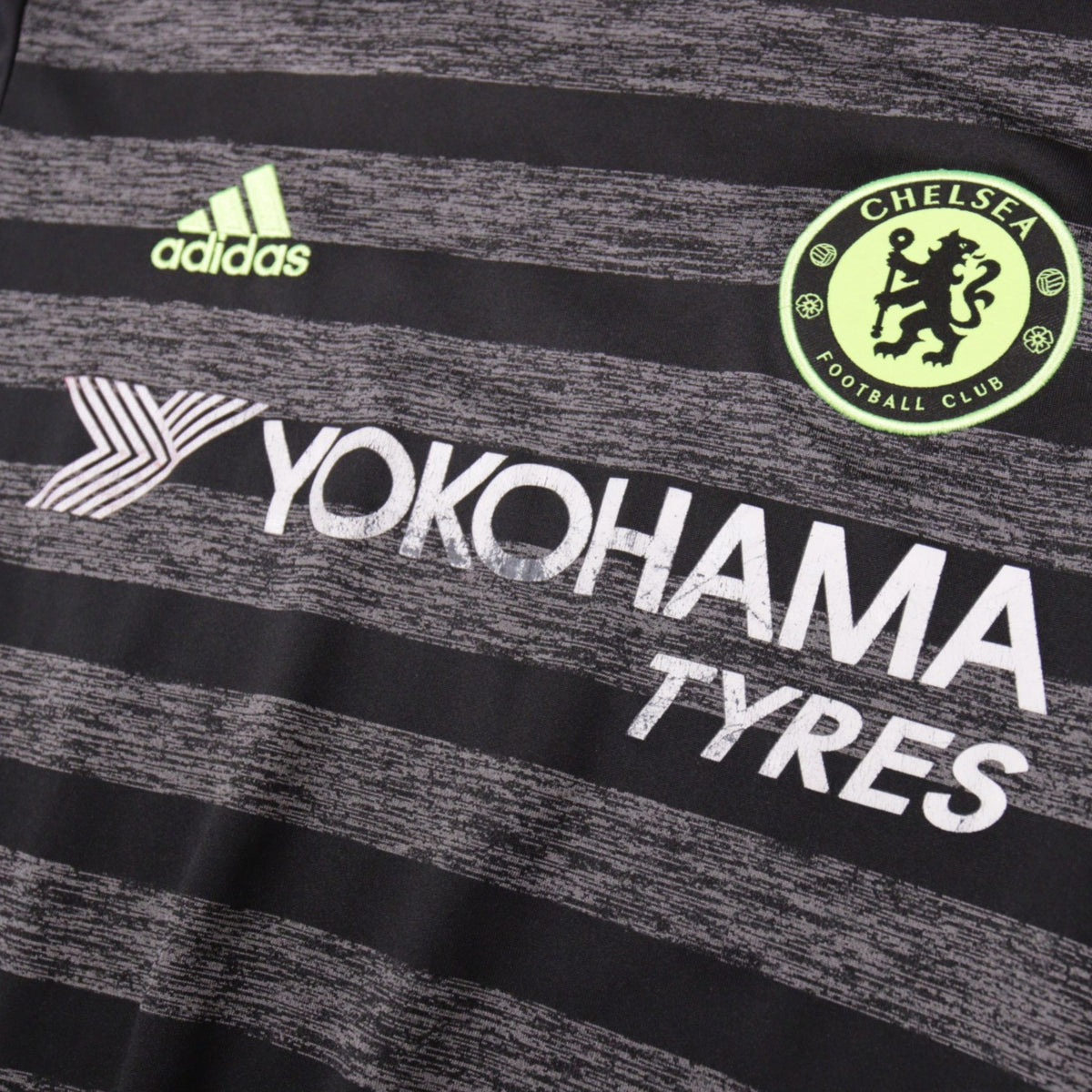 Close-up of adidas logo, Chelsea crest and Yokohama Tyres sponsor on the shirt