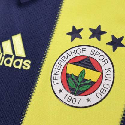 Close-up of Fenerbahçe crest with three stars and adidas logo on the shirt