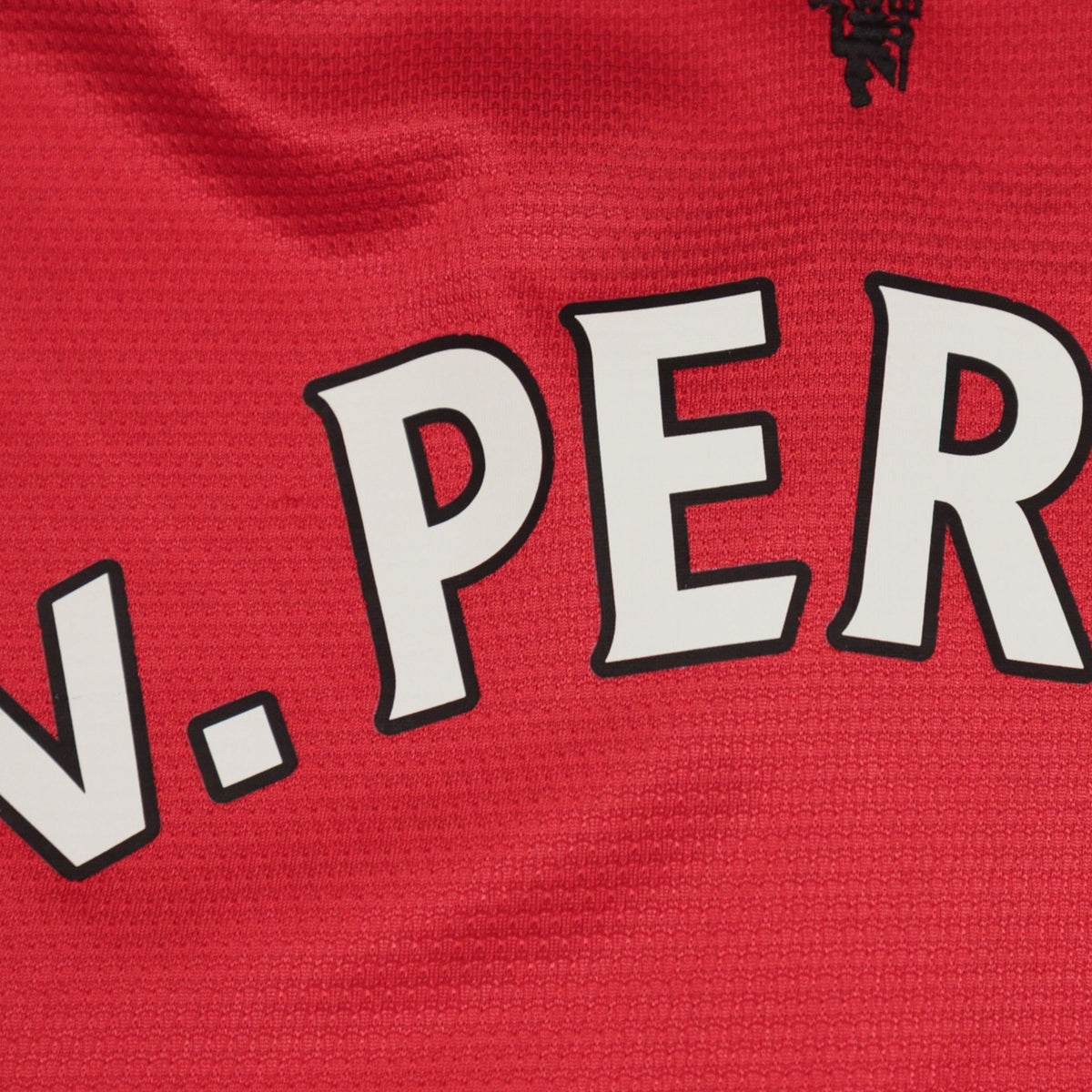 Close-up of the V. Persie name print showing surface cracking
