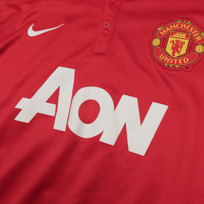 Close-up of the Manchester United crest and AON sponsor on the chest