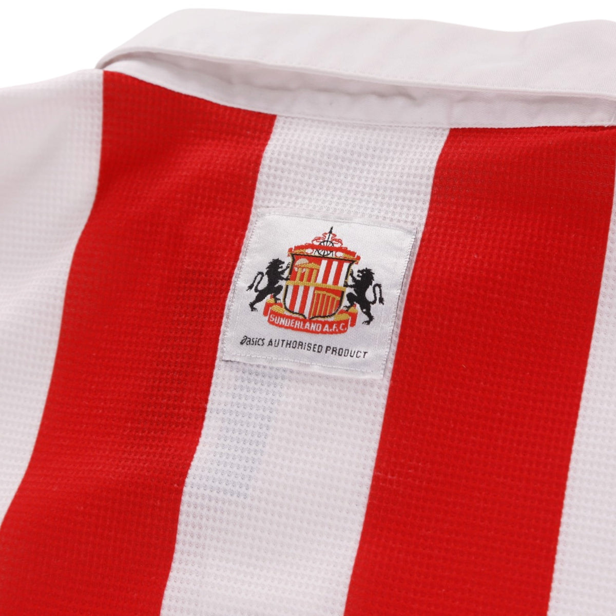 Close-up of Sunderland crest and Asics label on the back collar