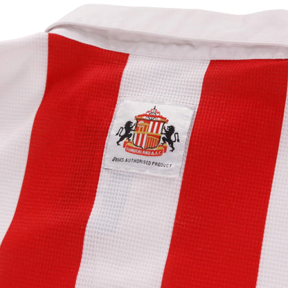Close-up of Sunderland crest and Asics label on the back collar