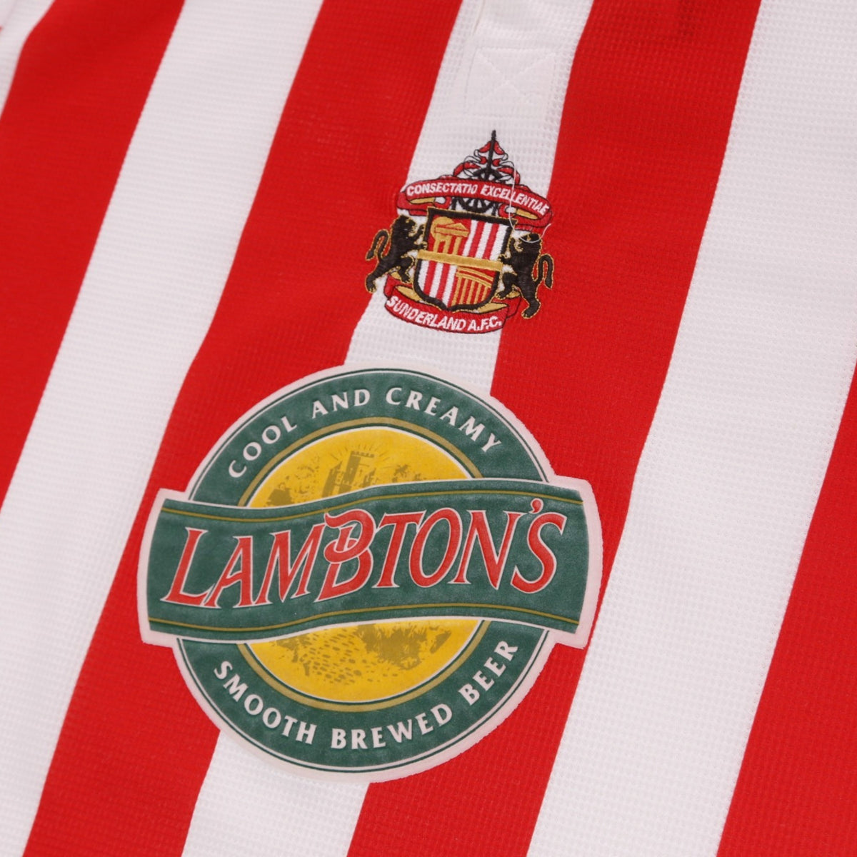 Close-up of Sunderland club crest and Lambton's sponsor logo on the chest