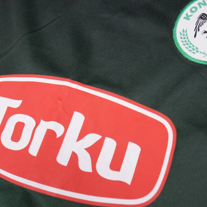 Close-up detail of Torku sponsor and Konyaspor crest on shirt front
