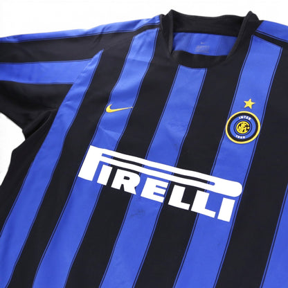 Close-up of the Inter Milan crest, Nike swoosh and Pirelli sponsor on the chest