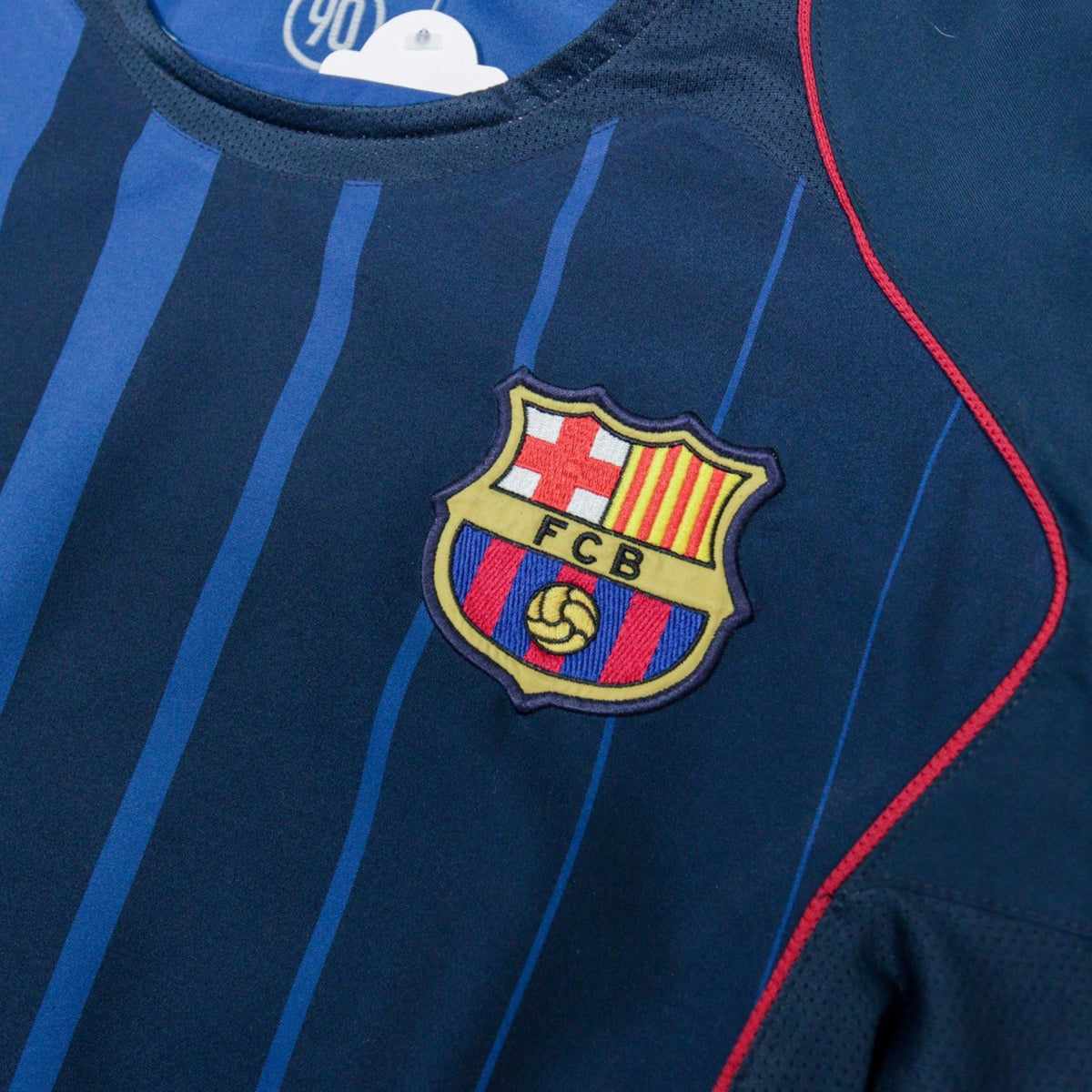 Close-up of the FC Barcelona crest and Nike swoosh on the chest