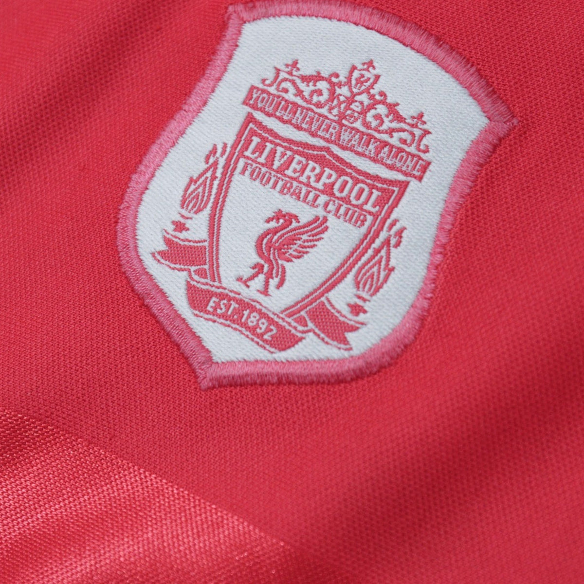 Close-up of Liverpool Football Club crest on shirt chest