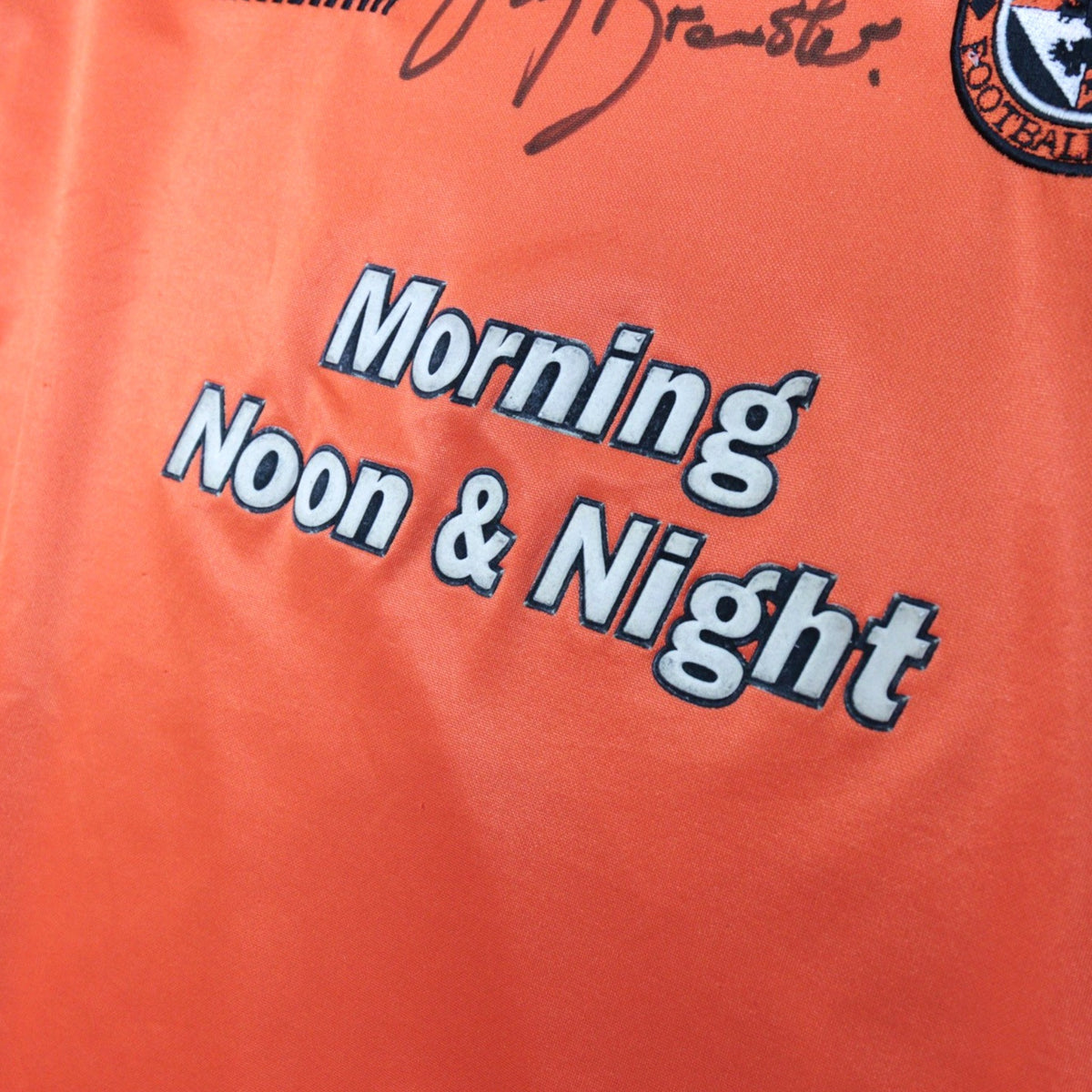 Close-up of the Morning Noon & Night sponsor on the Dundee United shirt