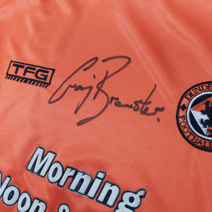 Close-up of the signature and TFG logo on the Dundee United shirt