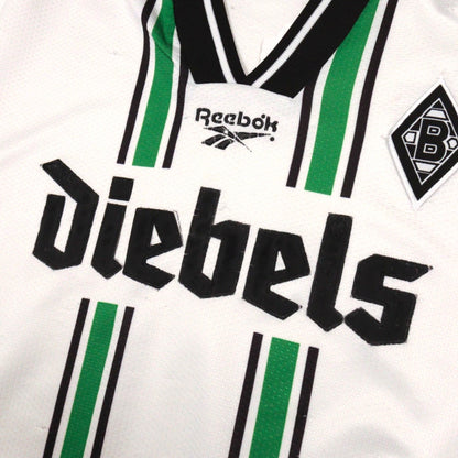 Close-up of Reebok logo, Diebels sponsor and club crest on the chest