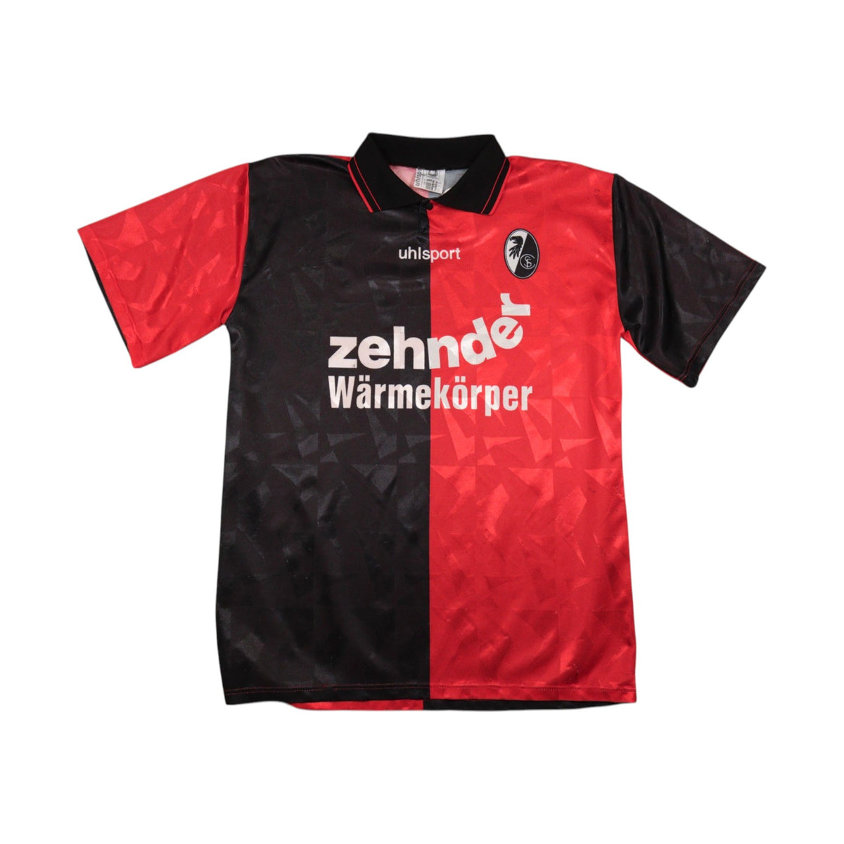 Front of the SC Freiburg 1996/97 home shirt, halved black and red with Zehnder sponsor.