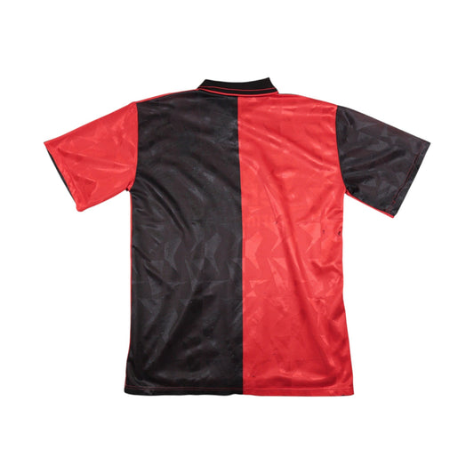 Back of the SC Freiburg 1996/97 home shirt showing the halved black and red design.