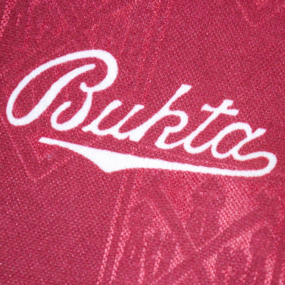 Close-up of the Bukta manufacturer logo on the shirt