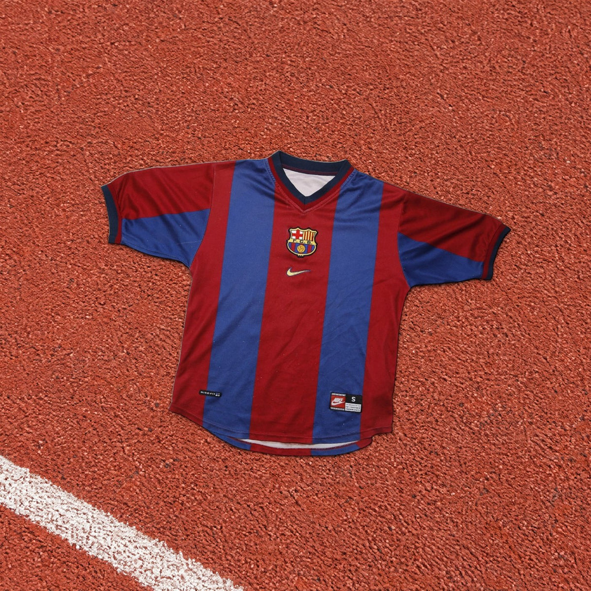 A Barcelona shirt from the shop on a running track