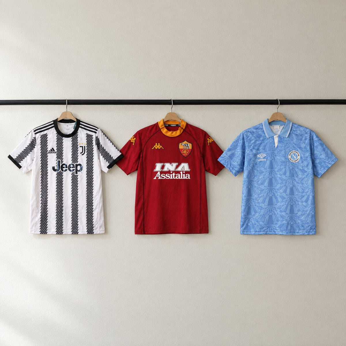 Juventus, Roma and Napoli shirts from the shop hanging on a rail
