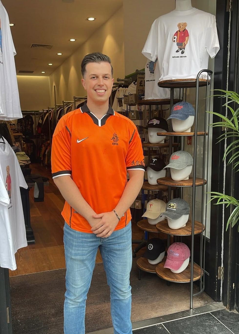 A Forever Vintage customer with the shirt they bought, in the Hanover Street shop