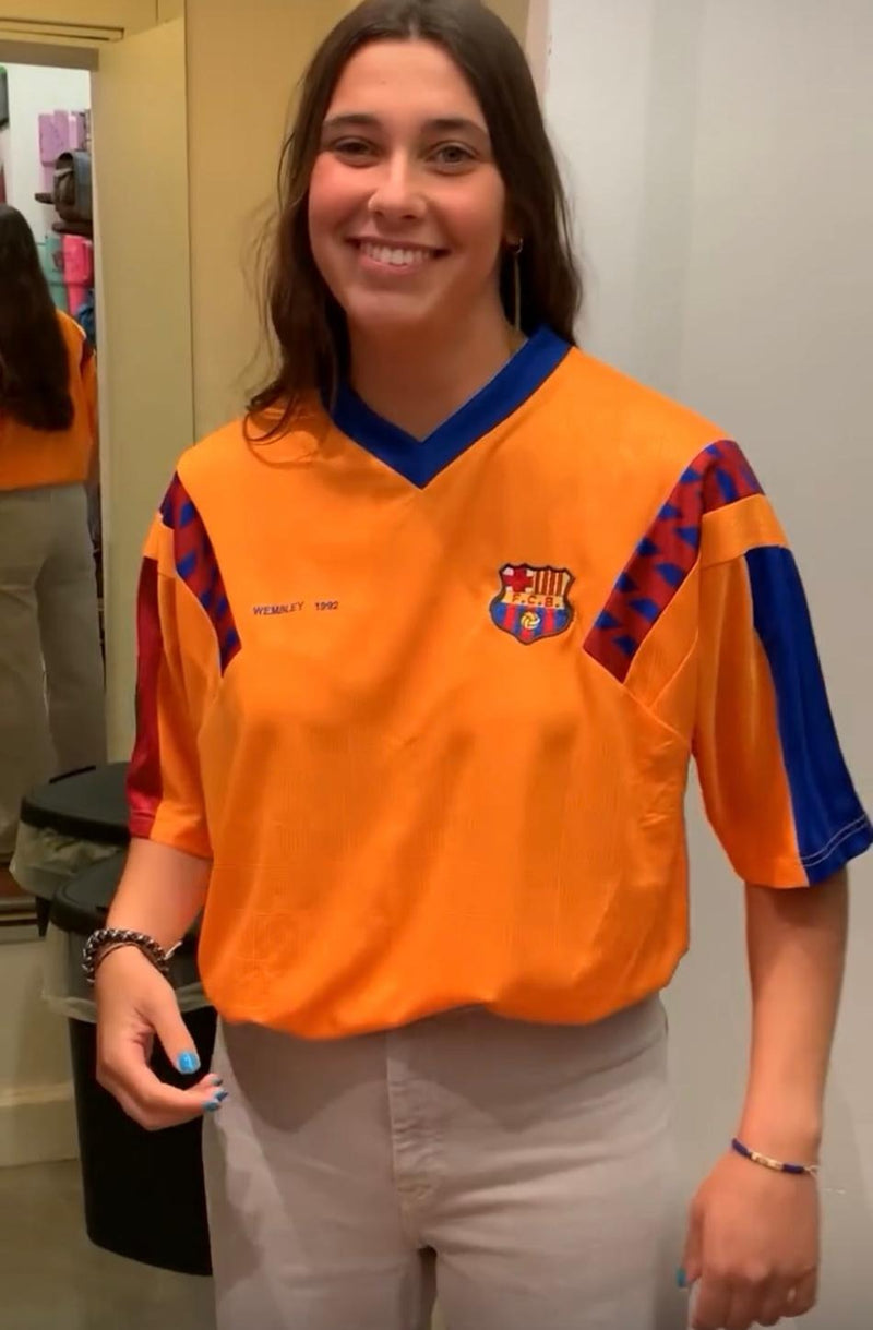 A Forever Vintage customer with the shirt they bought, in the Hanover Street shop