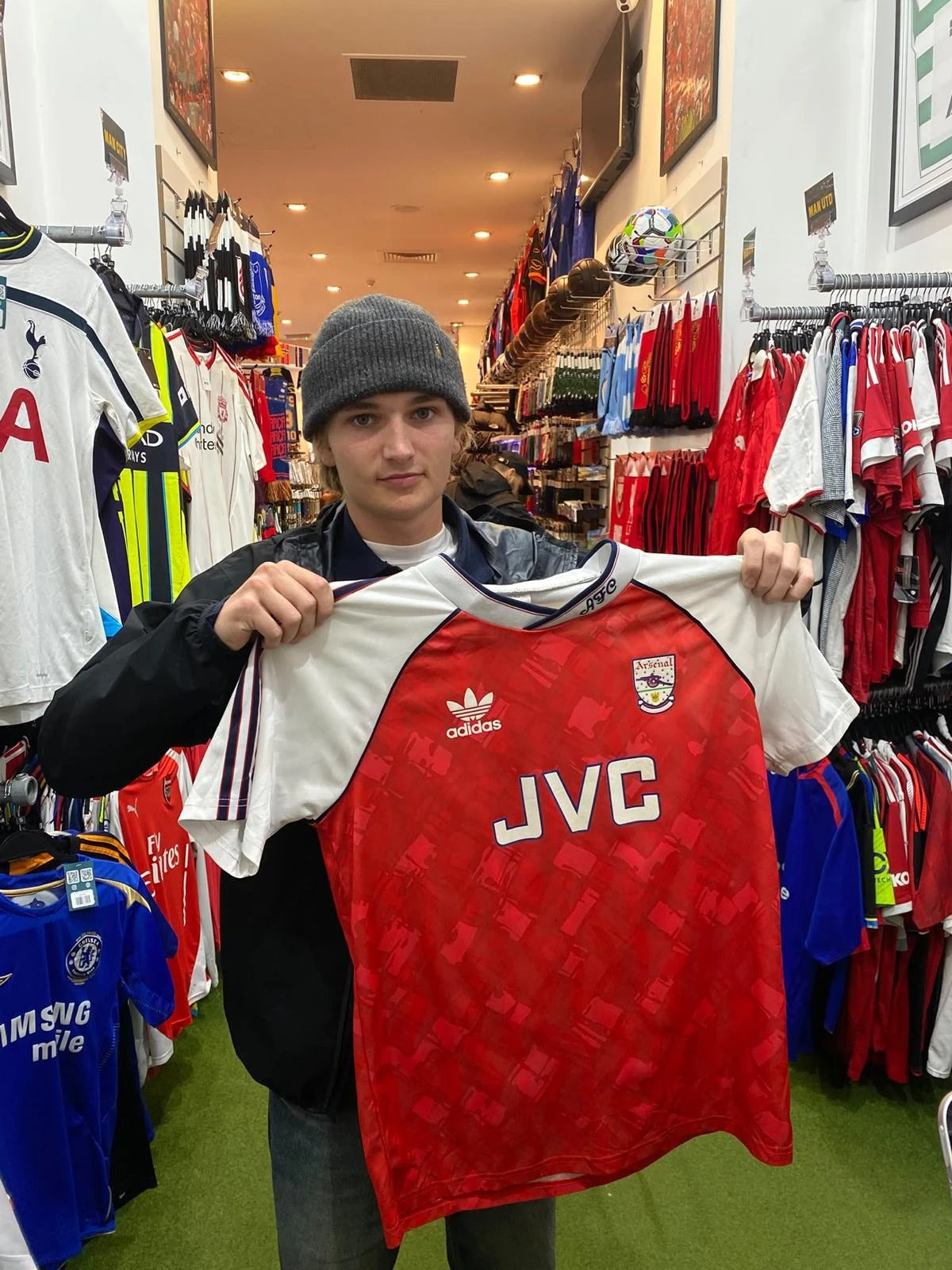A Forever Vintage customer with the shirt they bought, in the Hanover Street shop