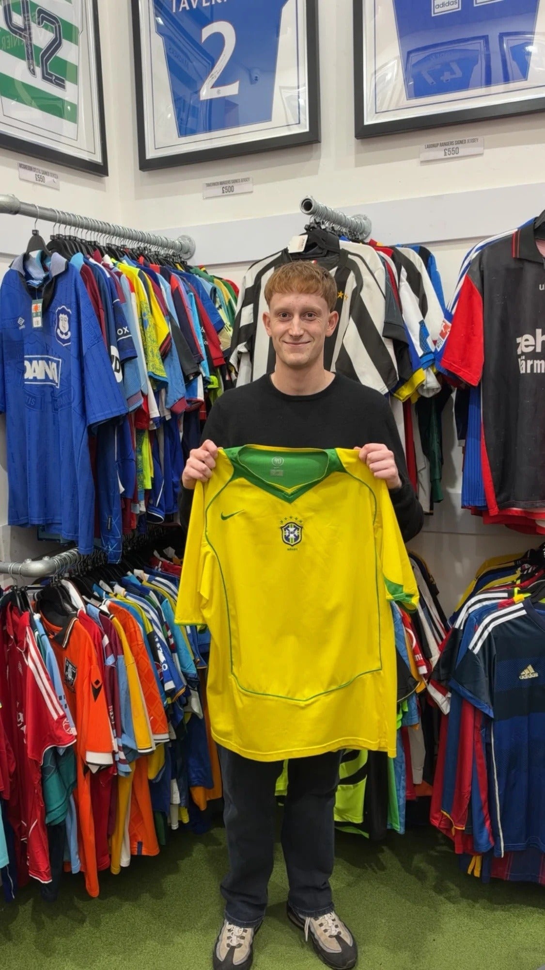 A Forever Vintage customer with the shirt they bought, in the Hanover Street shop